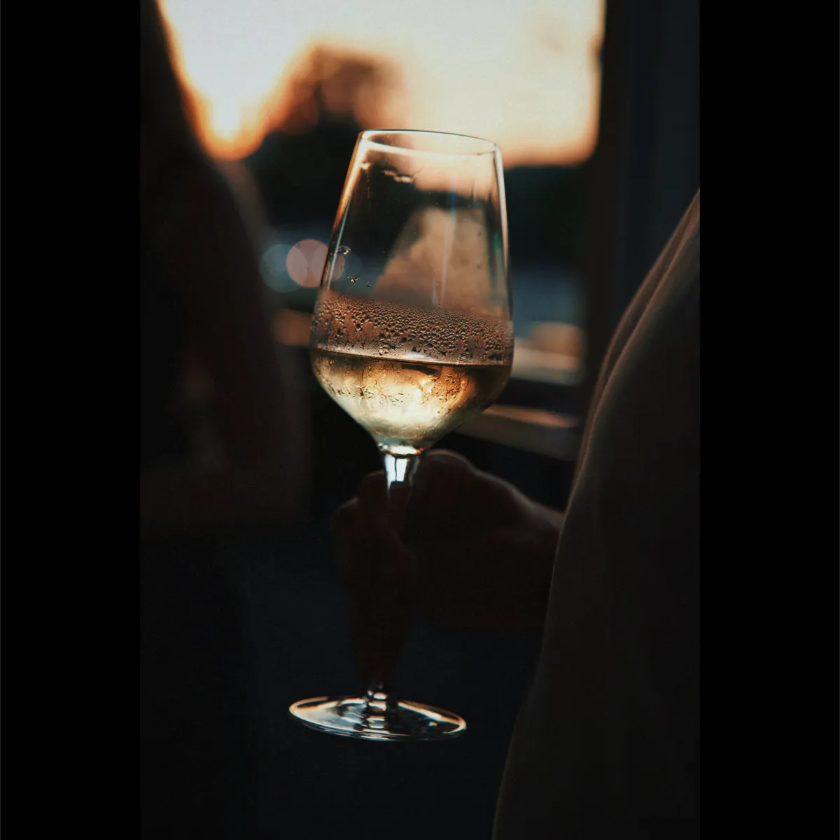 A glass of wine at sunset